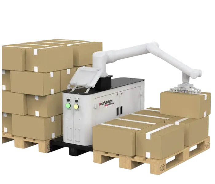 Industrial robot performing automated machine tending operation